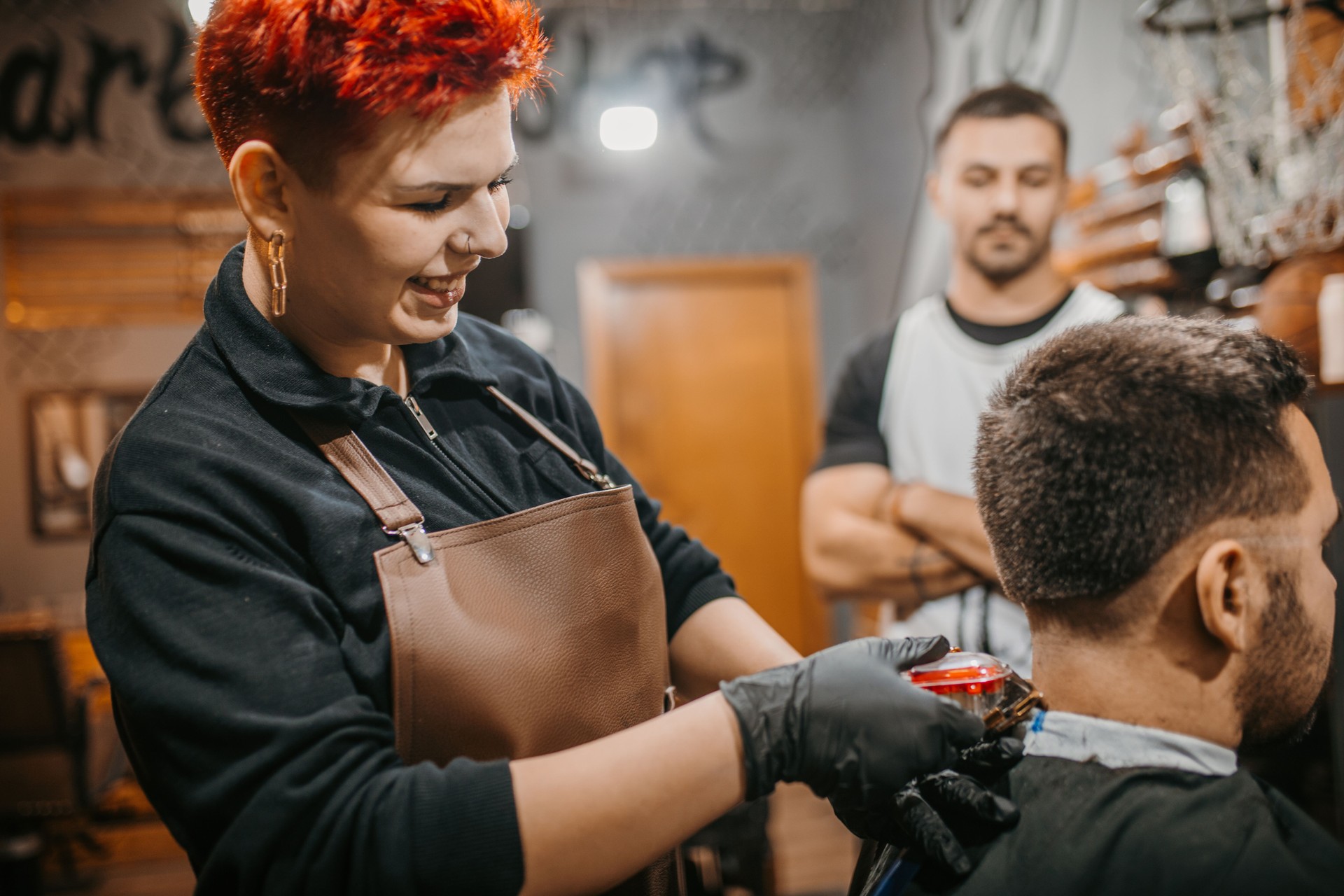 Female barber training in a barber salon